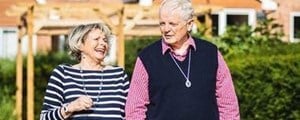 Older couple wearing personal alarms