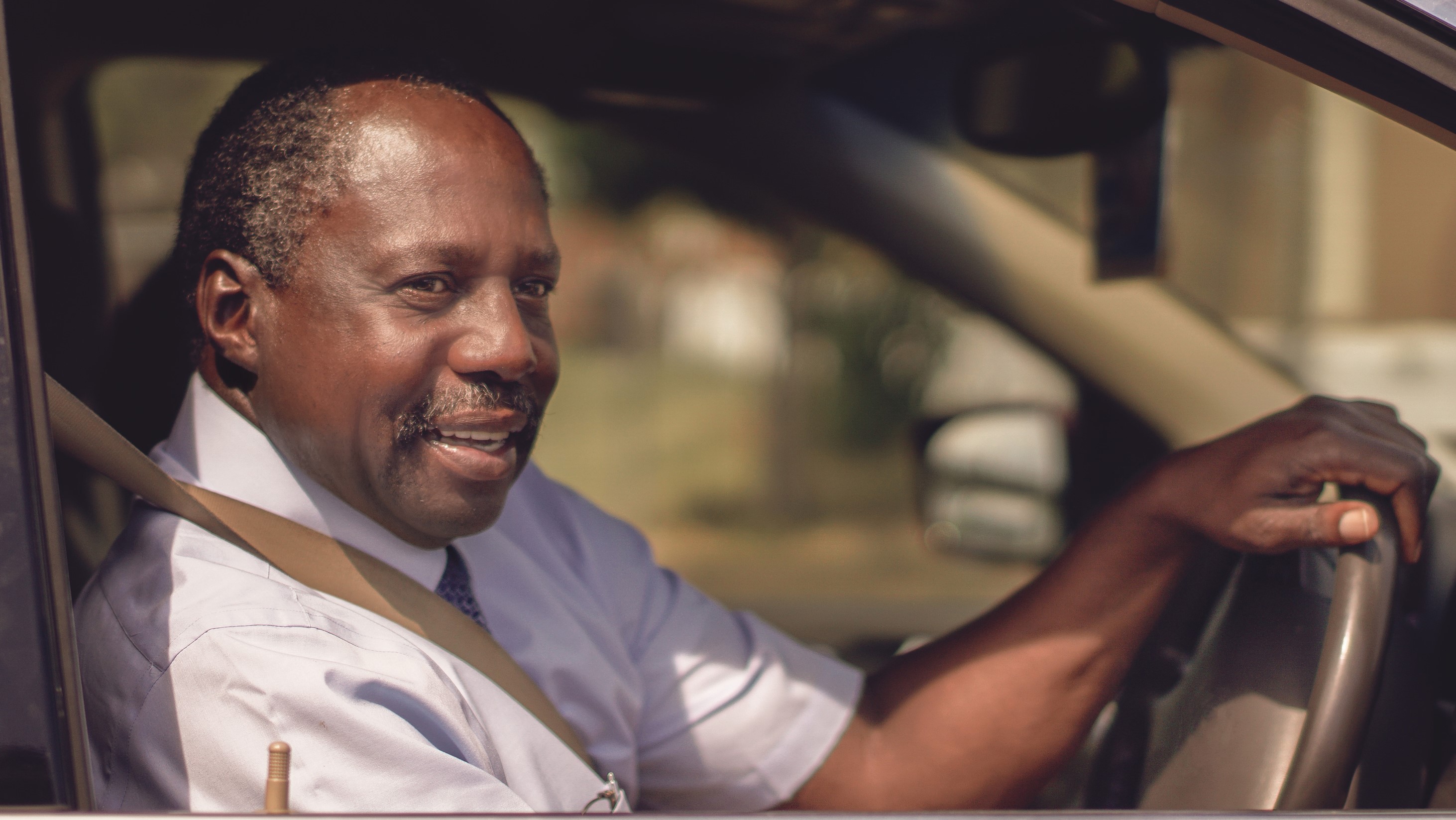 How Do I Renew My Driving Licence At 70 Age Co   00142   Smiling Man Driving Car   16 9 