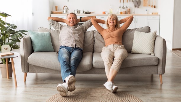 Happy mature couple-sitting on the couch