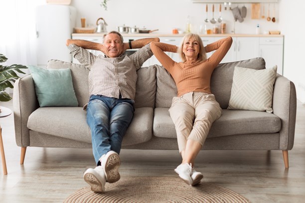 Happy mature couple-sitting on the couch