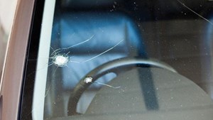 Chipped and cracked windshield on car