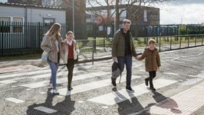 Family crossing road on zebra crossing