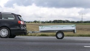 Car towing trailer