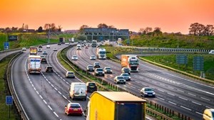 Busy motorway junction at sunset