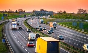 Busy motorway junction at sunset