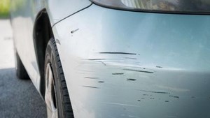 Close-up of scratched car bumper