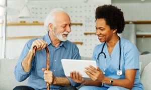 Man with nurse seeing tech options