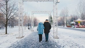 Older couple go for winter walk