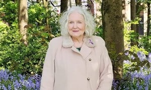 Lillian posing in a wood for her poetry collection.