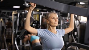 Woman lifting weights in the gym