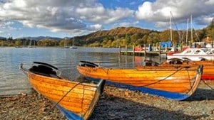 Small wooden boats on a shoreline