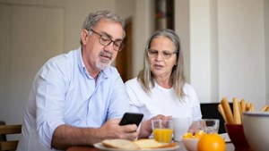 A couple discuss their home insurance options for renting