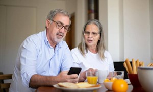 A couple discuss their home insurance options for renting