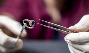 Sapphire ring being examined for valuation