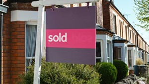 Sold sign outside house