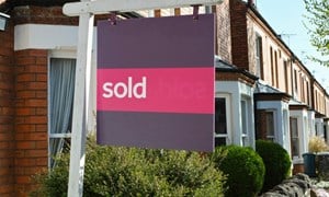 Sold sign outside house