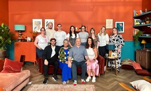 The cast and crew of our feel good advert pose on the sofa