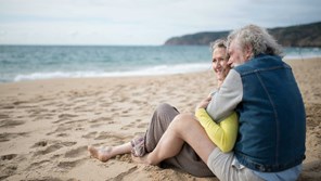 Couple cuddling on the beach